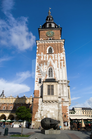 To use this stock image in your creative project, please select the size you need over to the right and click the "Add to Cart" button.
Your downloaded image will come with the Cutcaster watermark removed so don’t worry about the watermark you see on this page. Town Hall Tower in Cracow stock photo, Town Hall gothic tower in Main Market Square in the Old Town district of Cracow, Poland. Built of stone and brick at the end of the 13th century, It's cellars once housed a city prison with a medieval torture chamber. by Rognar