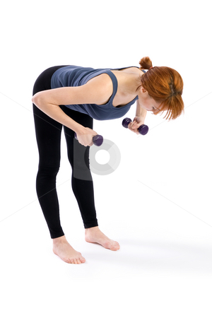 To use this stock image in your creative project, please select the size you need over to the right and click the "Add to Cart" button.
Your downloaded image will come with the Cutcaster watermark removed so don’t worry about the watermark you see on this page. Aerobic Exercise stock photo, Young fitness woman doing aerobic exercise with dumbbells, isolated on white. by Rognar