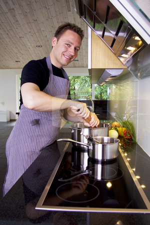 To use this stock image in your creative project, please select the size you need over to the right and click the "Add to Cart" button.
Your downloaded image will come with the Cutcaster watermark removed so don’t worry about the watermark you see on this page. Chef cooking stock photo, Chef adding pepper to the saucepan using a grinder by Daniel Kafer