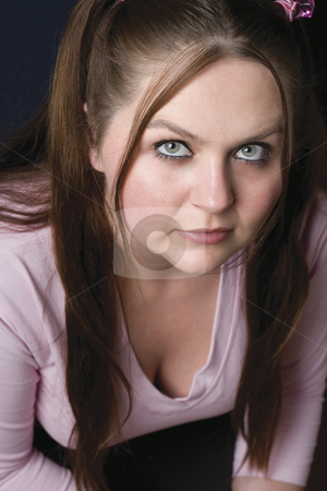 To use this stock image in your creative project, please select the size you need over to the right and click the "Add to Cart" button.
Your downloaded image will come with the Cutcaster watermark removed so don’t worry about the watermark you see on this page. Female model stock photo, Twenty something model wearing pink shirt looking up to the camera by Yann Poirier