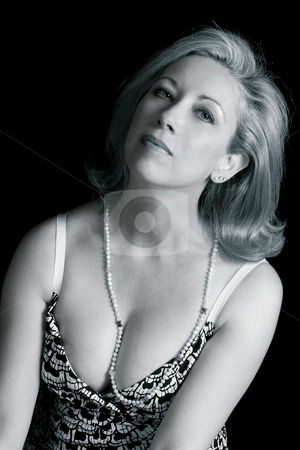 To use this stock image in your creative project, please select the size you need over to the right and click the "Add to Cart" button.
Your downloaded image will come with the Cutcaster watermark removed so don’t worry about the watermark you see on this page. Fashion model - sexy black and white stock photo, Fifty something women in relax position by Yann Poirier