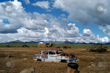To use this stock image in your creative project, please select the size you need over to the right and click the "Add to Cart" button.
Your downloaded image will come with the Cutcaster watermark removed so don’t worry about the watermark you see on this page. Stuck stock photo, USA, Idaho, Elmore County, Prairie, Car in a Muddy Pasture by David Ryan