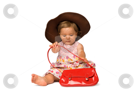 To use this stock image in your creative project, please select the size you need over to the right and click the "Add to Cart" button.
Your downloaded image will come with the Cutcaster watermark removed so don’t worry about the watermark you see on this page. Baby Girl Fashion Model stock photo, One year old fashion model posing with purse and hat, isolated over white background. by Rognar