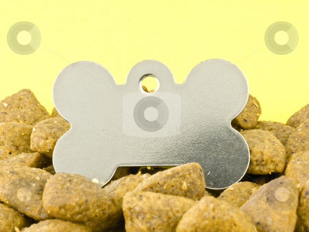 To use this stock image in your creative project, please select the size you need over to the right and click the "Add to Cart" button.
Your downloaded image will come with the Cutcaster watermark removed so don’t worry about the watermark you see on this page. Blank dog tag stock photo, Blank Dog Tag in Kibble on a Yellow Background by John Teeter