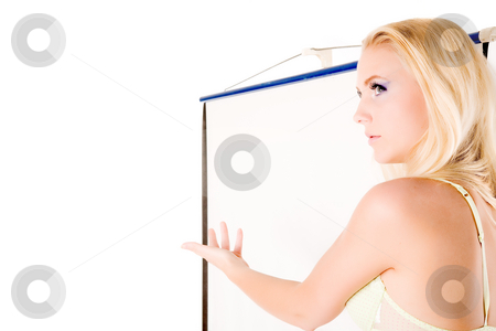 To use this stock image in your creative project, please select the size you need over to the right and click the "Add to Cart" button.
Your downloaded image will come with the Cutcaster watermark removed so don’t worry about the watermark you see on this page. Waist shot lingery model presenting stock photo, Lingery model standing next to a white projector screen.
Ideal for using as copy space for your message by Frenk and Danielle Kaufmann