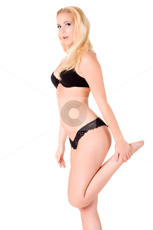 To use this stock image in your creative project, please select the size you need over to the right and click the "Add to Cart" button.
Your downloaded image will come with the Cutcaster watermark removed so don’t worry about the watermark you see on this page. Pulling my leg up in lingery stock photo, Blond model in black lingery.
Usable for lingery, emo, health and beauty, several arts of expressionals and others. by Frenk and Danielle Kaufmann