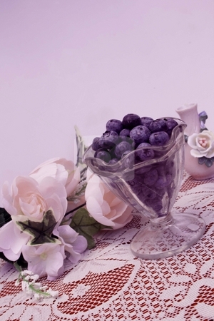 To use this stock image in your creative project, please select the size you need over to the right and click the "Add to Cart" button.
Your downloaded image will come with the Cutcaster watermark removed so don’t worry about the watermark you see on this page. Blueberries stock photo, Bowl of blueberries with roses in the background and space for copy by Shirley Mathews