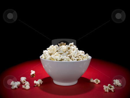 To use this stock image in your creative project, please select the size you need over to the right and click the "Add to Cart" button.
Your downloaded image will come with the Cutcaster watermark removed so don’t worry about the watermark you see on this page. Popcorn bowl stock photo, A bowl full of popcorn under the spotlight. by Ignacio Gonzalez Prado
