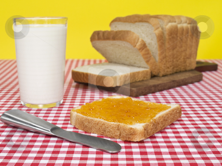 To use this stock image in your creative project, please select the size you need over to the right and click the "Add to Cart" button.
Your downloaded image will come with the Cutcaster watermark removed so don’t worry about the watermark you see on this page. Quick breakfast stock photo, A slice of bread spread with jam beside a loaf of bread and a glass of milk. by Ignacio Gonzalez Prado