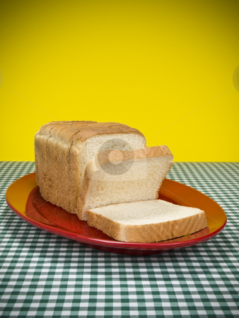 To use this stock image in your creative project, please select the size you need over to the right and click the "Add to Cart" button.
Your downloaded image will come with the Cutcaster watermark removed so don’t worry about the watermark you see on this page. Sliced bread stock photo, A loaf of sliced bread served on a red platter. by Ignacio Gonzalez Prado