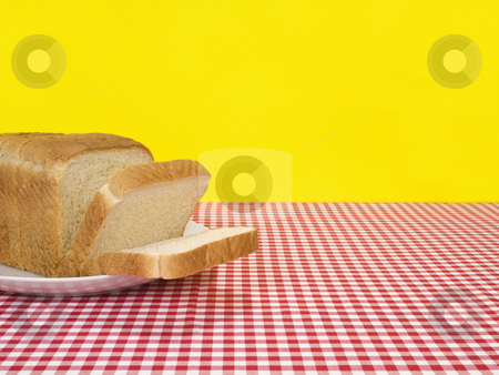 To use this stock image in your creative project, please select the size you need over to the right and click the "Add to Cart" button.
Your downloaded image will come with the Cutcaster watermark removed so don’t worry about the watermark you see on this page. Fresh bread stock photo, A loaf of bread sliced and served on the table. by Ignacio Gonzalez Prado