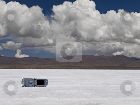 To use this stock image in your creative project, please select the size you need over to the right and click the "Add to Cart" button.
Your downloaded image will come with the Cutcaster watermark removed so don’t worry about the watermark you see on this page. Hanging on stock photo, A cell phone abandoned on a salt field. Mountains on the background. by Ignacio Gonzalez Prado