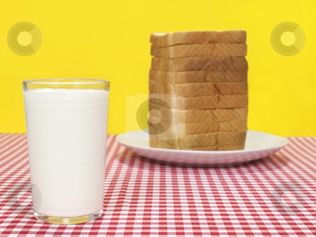 To use this stock image in your creative project, please select the size you need over to the right and click the "Add to Cart" button.
Your downloaded image will come with the Cutcaster watermark removed so don’t worry about the watermark you see on this page. Milk and bread stock photo, A glass of milk and a sliced loaf of bread. by Ignacio Gonzalez Prado