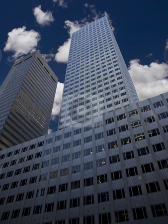 To use this stock image in your creative project, please select the size you need over to the right and click the "Add to Cart" button.
Your downloaded image will come with the Cutcaster watermark removed so don’t worry about the watermark you see on this page. Skyscraper stock photo, New York skyscraper against a blue sky and some clouds. by Ignacio Gonzalez Prado