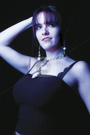 To use this stock image in your creative project, please select the size you need over to the right and click the "Add to Cart" button.
Your downloaded image will come with the Cutcaster watermark removed so don’t worry about the watermark you see on this page. Fashion model - Blue lighting stock photo, Twenty something fashion model posing under blue lighting by Yann Poirier