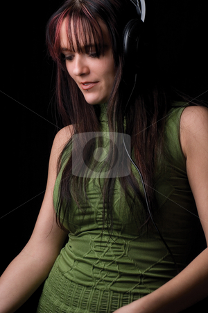 To use this stock image in your creative project, please select the size you need over to the right and click the "Add to Cart" button.
Your downloaded image will come with the Cutcaster watermark removed so don’t worry about the watermark you see on this page. Fashion model - listening to music stock photo, Twenty something fashion model listening to music with big headphone by Yann Poirier