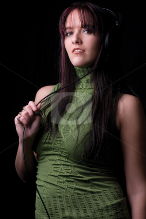 To use this stock image in your creative project, please select the size you need over to the right and click the "Add to Cart" button.
Your downloaded image will come with the Cutcaster watermark removed so don’t worry about the watermark you see on this page. Fashion model - listening to music stock photo, Twenty something fashion model listening to music with big headphone by Yann Poirier