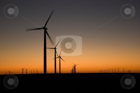 To use this stock image in your creative project, please select the size you need over to the right and click the "Add to Cart" button.
Your downloaded image will come with the Cutcaster watermark removed so don’t worry about the watermark you see on this page. Evening Glow stock photo, Evening last glow on a field of a wind farm by Charles Buegeler