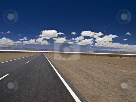 To use this stock image in your creative project, please select the size you need over to the right and click the "Add to Cart" button.
Your downloaded image will come with the Cutcaster watermark removed so don’t worry about the watermark you see on this page. Hitting the road stock photo, A straight road to the salt mine. Blurred by the motion. by Ignacio Gonzalez Prado