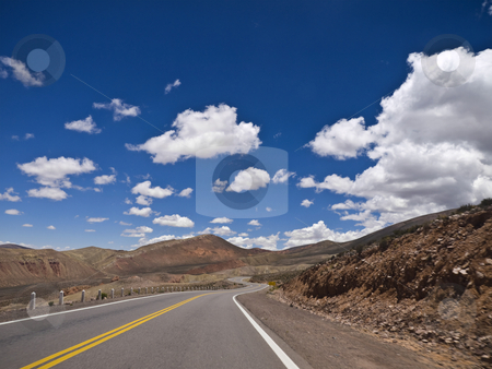 To use this stock image in your creative project, please select the size you need over to the right and click the "Add to Cart" button.
Your downloaded image will come with the Cutcaster watermark removed so don’t worry about the watermark you see on this page. Curves ahead stock photo, A winding road ahead. Small motion blur. by Ignacio Gonzalez Prado