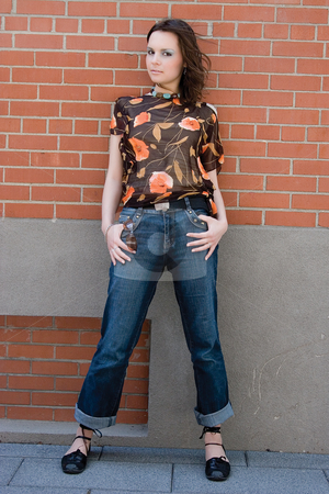 To use this stock image in your creative project, please select the size you need over to the right and click the "Add to Cart" button.
Your downloaded image will come with the Cutcaster watermark removed so don’t worry about the watermark you see on this page. Girl hanging on brick wall stock photo, Twenty something fashion model giving a piercing look to the camera while hanging on a brick wall by Yann Poirier