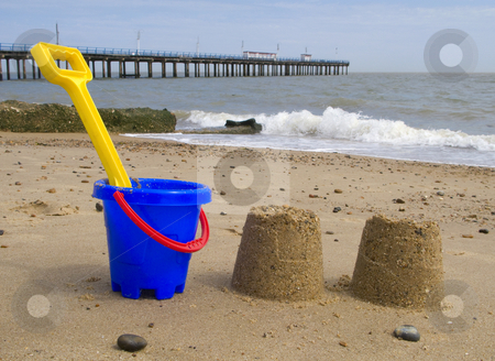 To use this stock image in your creative project, please select the size you need over to the right and click the "Add to Cart" button.
Your downloaded image will come with the Cutcaster watermark removed so don’t worry about the watermark you see on this page. Kids bucket, spade and sandcastles on Felixstowe beach. stock photo, Kids bucket, spade and sandcastles on Felixstowe beach. by Stephen Rees