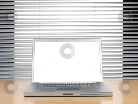 To use this stock image in your creative project, please select the size you need over to the right and click the "Add to Cart" button.
Your downloaded image will come with the Cutcaster watermark removed so don’t worry about the watermark you see on this page. Laptop and blinds stock photo, A laptop on a table at a modern office. by Ignacio Gonzalez Prado