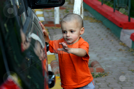 To use this stock image in your creative project, please select the size you need over to the right and click the "Add to Cart" button.
Your downloaded image will come with the Cutcaster watermark removed so don’t worry about the watermark you see on this page. I'm getting the Door stock photo, Little Boy Unlocking the Car Door by Mehmet Dilsiz