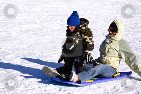 To use this stock image in your creative project, please select the size you need over to the right and click the "Add to Cart" button.
Your downloaded image will come with the Cutcaster watermark removed so don’t worry about the watermark you see on this page. Mother and two Sons Sledding down the Hill stock photo, Mother and Son Sledding down the Hill While the Boy is Trying to Stand Up by Mehmet Dilsiz