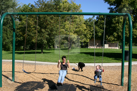 To use this stock image in your creative project, please select the size you need over to the right and click the "Add to Cart" button.
Your downloaded image will come with the Cutcaster watermark removed so don’t worry about the watermark you see on this page. Mother and Little Boy Swinging stock photo, Mother and little boy swinging in the park by Mehmet Dilsiz