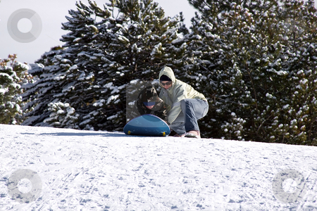 To use this stock image in your creative project, please select the size you need over to the right and click the "Add to Cart" button.
Your downloaded image will come with the Cutcaster watermark removed so don’t worry about the watermark you see on this page. Mother and Son Sledding down the Hill stock photo, Mother and Son Sledding down the Hill - Winter Scenes by Mehmet Dilsiz