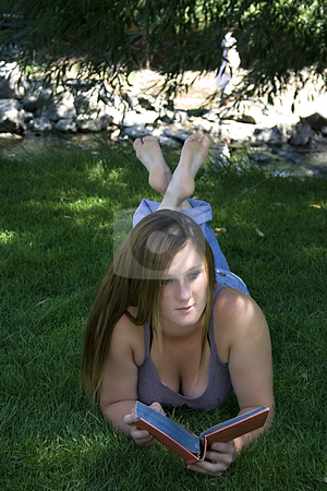 To use this stock image in your creative project, please select the size you need over to the right and click the "Add to Cart" button.
Your downloaded image will come with the Cutcaster watermark removed so don’t worry about the watermark you see on this page. Beautiful Girl in the Park Reading a Book stock photo, Close up on a Beautiful Girl Laying Down in the Park Reading a Book by Mehmet Dilsiz