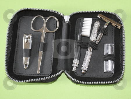 To use this stock image in your creative project, please select the size you need over to the right and click the "Add to Cart" button.
Your downloaded image will come with the Cutcaster watermark removed so don’t worry about the watermark you see on this page. A small travel kit stock photo, Pocket size travel kit with scissors nail clippers toothbrush and razor by Mike Smith