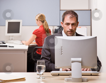 To use this stock image in your creative project, please select the size you need over to the right and click the "Add to Cart" button.
Your downloaded image will come with the Cutcaster watermark removed so don’t worry about the watermark you see on this page. Businessman typing on computer at desk stock photo, Businessman typing on computer at desk by Jonathan Ross