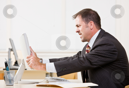 To use this stock image in your creative project, please select the size you need over to the right and click the "Add to Cart" button.
Your downloaded image will come with the Cutcaster watermark removed so don’t worry about the watermark you see on this page. Businessman adjusting computer monitor stock photo, Businessman adjusting computer monitor by Jonathan Ross