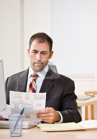To use this stock image in your creative project, please select the size you need over to the right and click the "Add to Cart" button.
Your downloaded image will come with the Cutcaster watermark removed so don’t worry about the watermark you see on this page. Businessman reviewing paperwork stock photo, Businessman reviewing paperwork by Jonathan Ross