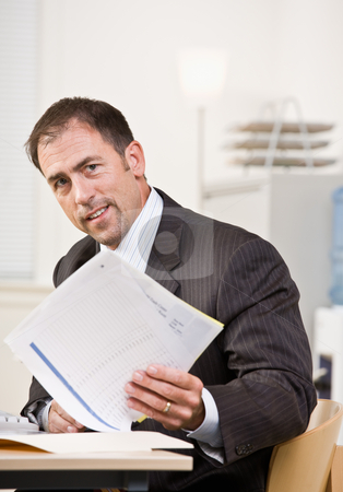 To use this stock image in your creative project, please select the size you need over to the right and click the "Add to Cart" button.
Your downloaded image will come with the Cutcaster watermark removed so don’t worry about the watermark you see on this page. Businessman reviewing paperwork stock photo, Businessman reviewing paperwork by Jonathan Ross