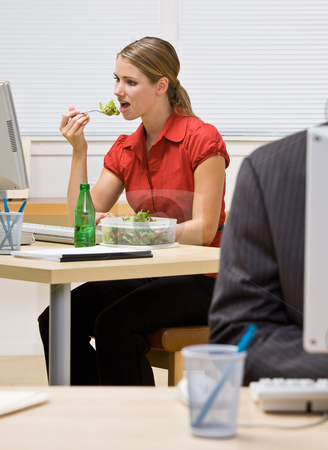 To use this stock image in your creative project, please select the size you need over to the right and click the "Add to Cart" button.
Your downloaded image will come with the Cutcaster watermark removed so don’t worry about the watermark you see on this page. Businesswoman eating salad at desk stock photo, Businesswoman eating salad at desk by Jonathan Ross