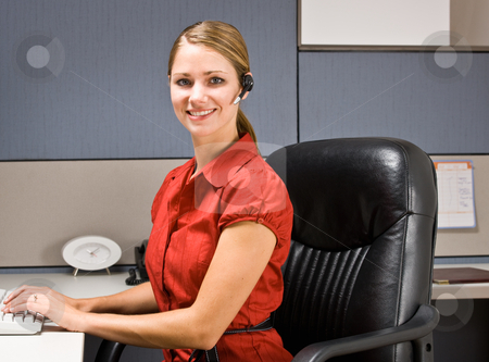 To use this stock image in your creative project, please select the size you need over to the right and click the "Add to Cart" button.
Your downloaded image will come with the Cutcaster watermark removed so don’t worry about the watermark you see on this page. Businesswoman talking on headset at desk stock photo, Businesswoman talking on headset at desk by Jonathan Ross