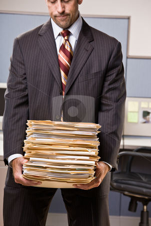 To use this stock image in your creative project, please select the size you need over to the right and click the "Add to Cart" button.
Your downloaded image will come with the Cutcaster watermark removed so don’t worry about the watermark you see on this page. Businessman carrying stack of file folders stock photo, Businessman carrying stack of file folders by Jonathan Ross