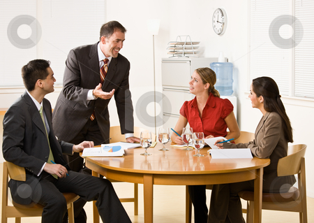 To use this stock image in your creative project, please select the size you need over to the right and click the "Add to Cart" button.
Your downloaded image will come with the Cutcaster watermark removed so don’t worry about the watermark you see on this page. Business people in a meeting stock photo, Business people in a meeting by Jonathan Ross