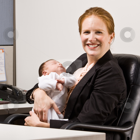 To use this stock image in your creative project, please select the size you need over to the right and click the "Add to Cart" button.
Your downloaded image will come with the Cutcaster watermark removed so don’t worry about the watermark you see on this page. Businesswoman holding baby at desk stock photo, Businesswoman holding baby at desk by Jonathan Ross