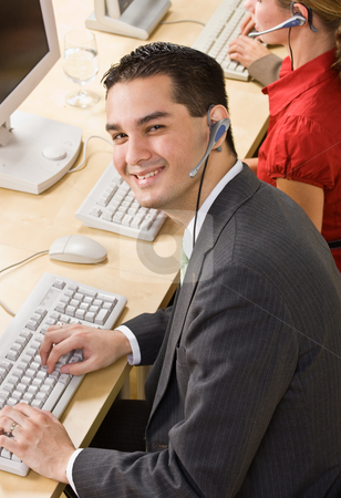 To use this stock image in your creative project, please select the size you need over to the right and click the "Add to Cart" button.
Your downloaded image will come with the Cutcaster watermark removed so don’t worry about the watermark you see on this page. Businessman talking on headsets stock photo, Businessman talking on headsets by Jonathan Ross