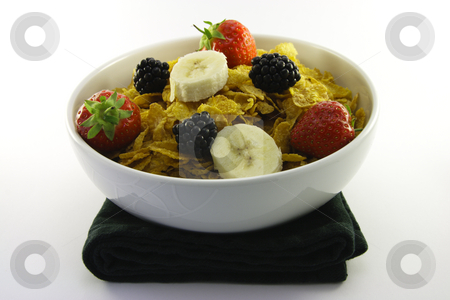 To use this stock image in your creative project, please select the size you need over to the right and click the "Add to Cart" button.
Your downloaded image will come with the Cutcaster watermark removed so don’t worry about the watermark you see on this page. Cornflakes and Fruit in a White Bowl stock photo, Cornflakes with strawberries, blackberries and banana in a round white bowl with a black napkin on a white background by Keith Wilson