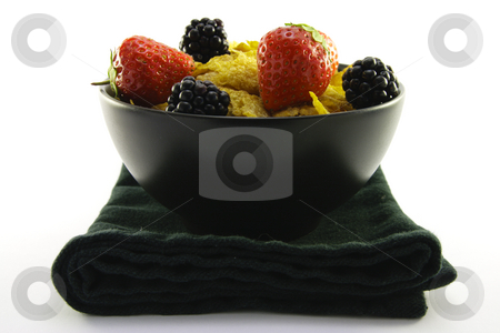 To use this stock image in your creative project, please select the size you need over to the right and click the "Add to Cart" button.
Your downloaded image will come with the Cutcaster watermark removed so don’t worry about the watermark you see on this page. Cornflakes and Fruit in a Black Bowl stock photo, Cornflakes with strawberries and blackberries in a round black bowl with a black napkin on a white background by Keith Wilson