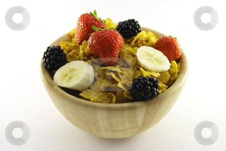 To use this stock image in your creative project, please select the size you need over to the right and click the "Add to Cart" button.
Your downloaded image will come with the Cutcaster watermark removed so don’t worry about the watermark you see on this page. Cornflakes and Fruit in a Wooden Bowl stock photo, Cornflakes with strawberries, blackberries and banana in a round wooden bowl on a white background by Keith Wilson