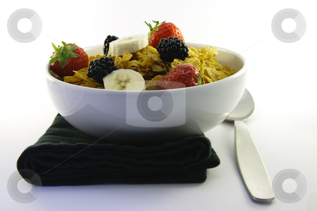 To use this stock image in your creative project, please select the size you need over to the right and click the "Add to Cart" button.
Your downloaded image will come with the Cutcaster watermark removed so don’t worry about the watermark you see on this page. Cornflakes and Fruit with Napkin and Spoon stock photo, Cornflakes with strawberries, blackberries and banana in a round white bowl with a black napkin and spoon on a white background by Keith Wilson