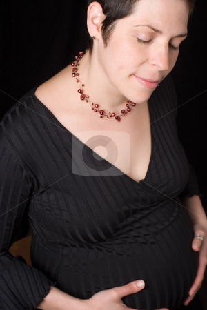 To use this stock image in your creative project, please select the size you need over to the right and click the "Add to Cart" button.
Your downloaded image will come with the Cutcaster watermark removed so don’t worry about the watermark you see on this page. Pregnant women stock photo, Sitting portrait of a late twenty pregnant women with close eye havin a moment with hey belly by Yann Poirier