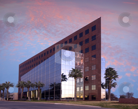To use this stock image in your creative project, please select the size you need over to the right and click the "Add to Cart" button.
Your downloaded image will come with the Cutcaster watermark removed so don’t worry about the watermark you see on this page. Airport Central stock photo, Palm trees and sunset create a tropical office lansdcape. by Charles Buegeler