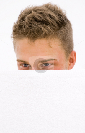 To use this stock image in your creative project, please select the size you need over to the right and click the "Add to Cart" button.
Your downloaded image will come with the Cutcaster watermark removed so don’t worry about the watermark you see on this page. Young man hiding stock photo, Young man hiding himself behind a white towel by Karin Claus